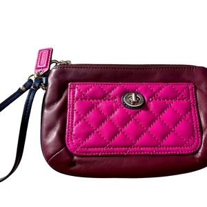 Coach wristlet, burgundy and purple, zip corner closure.